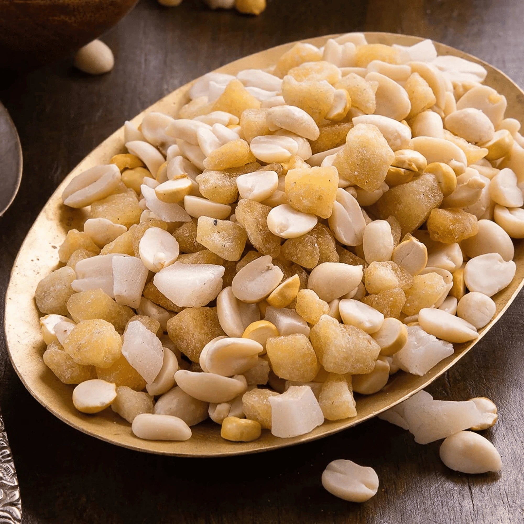 Assorted mixed yellu bella on a wooden plate with a wooden background