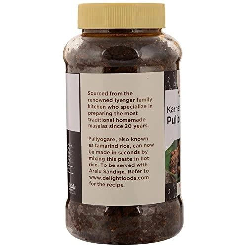 Jar of Puliyogare spice mix with a label on a white background