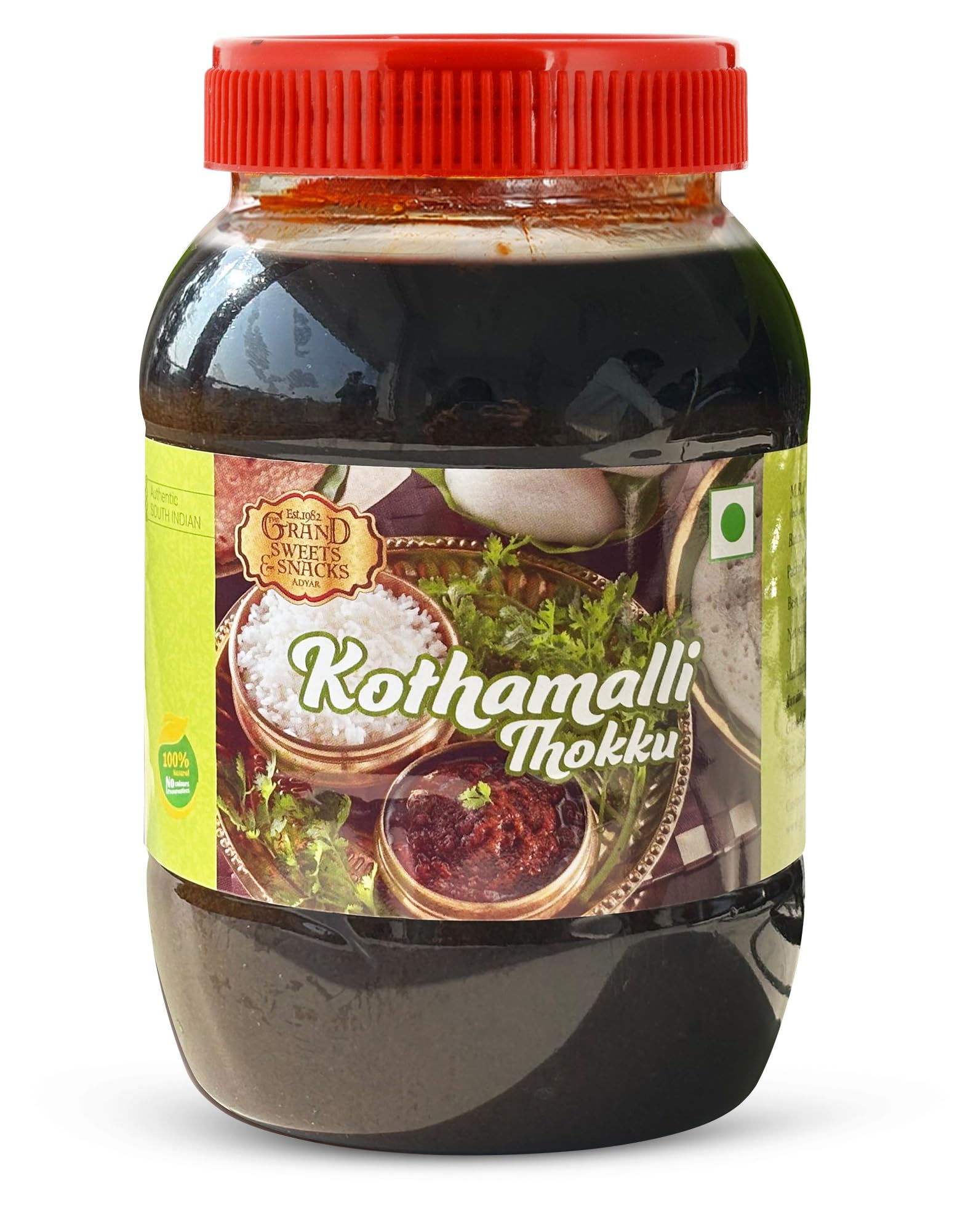 Jar of Kothamalli Thokku with a red lid on a white background