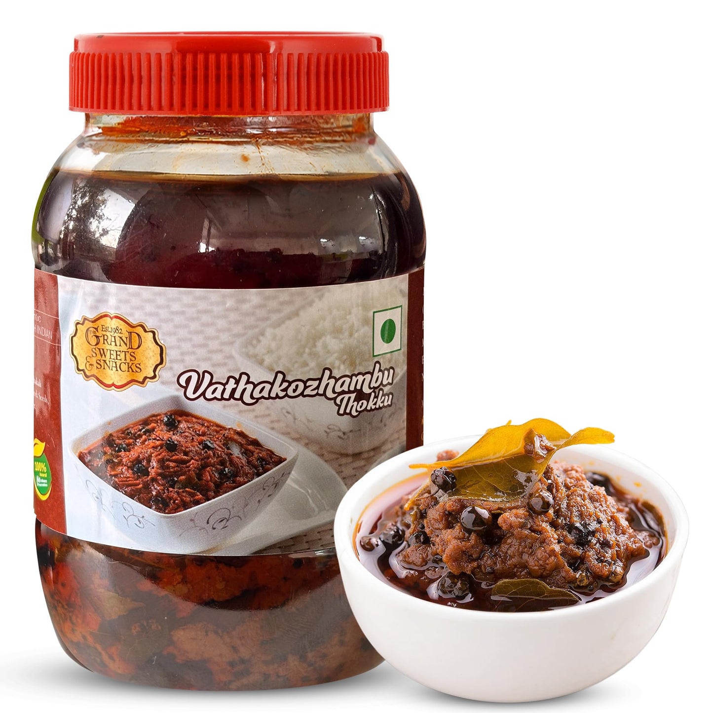 Jar of Vathakozhambu Thokku with a red lid and a bowl of the product on a white background