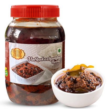 Jar of Vathakozhambu Thokku with a red lid and a bowl of the product on a white background