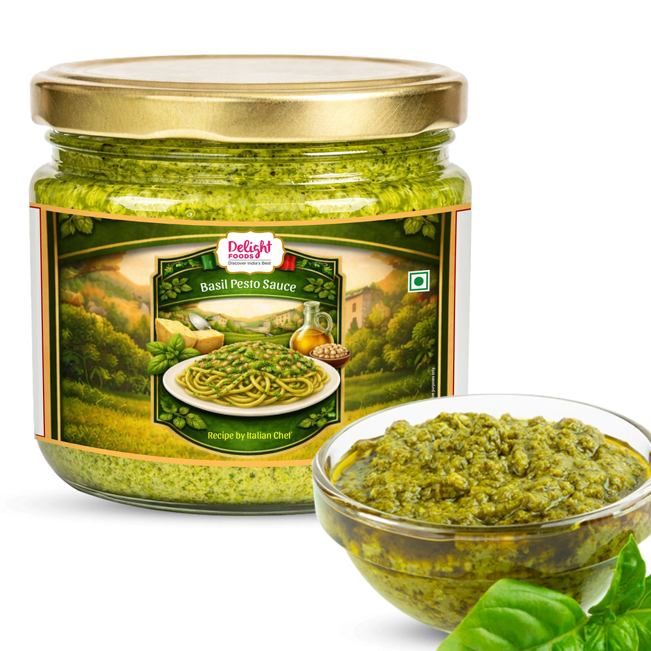 Jar of Delight Foods Basil Pesto Sauce with a bowl of pesto on a white background
