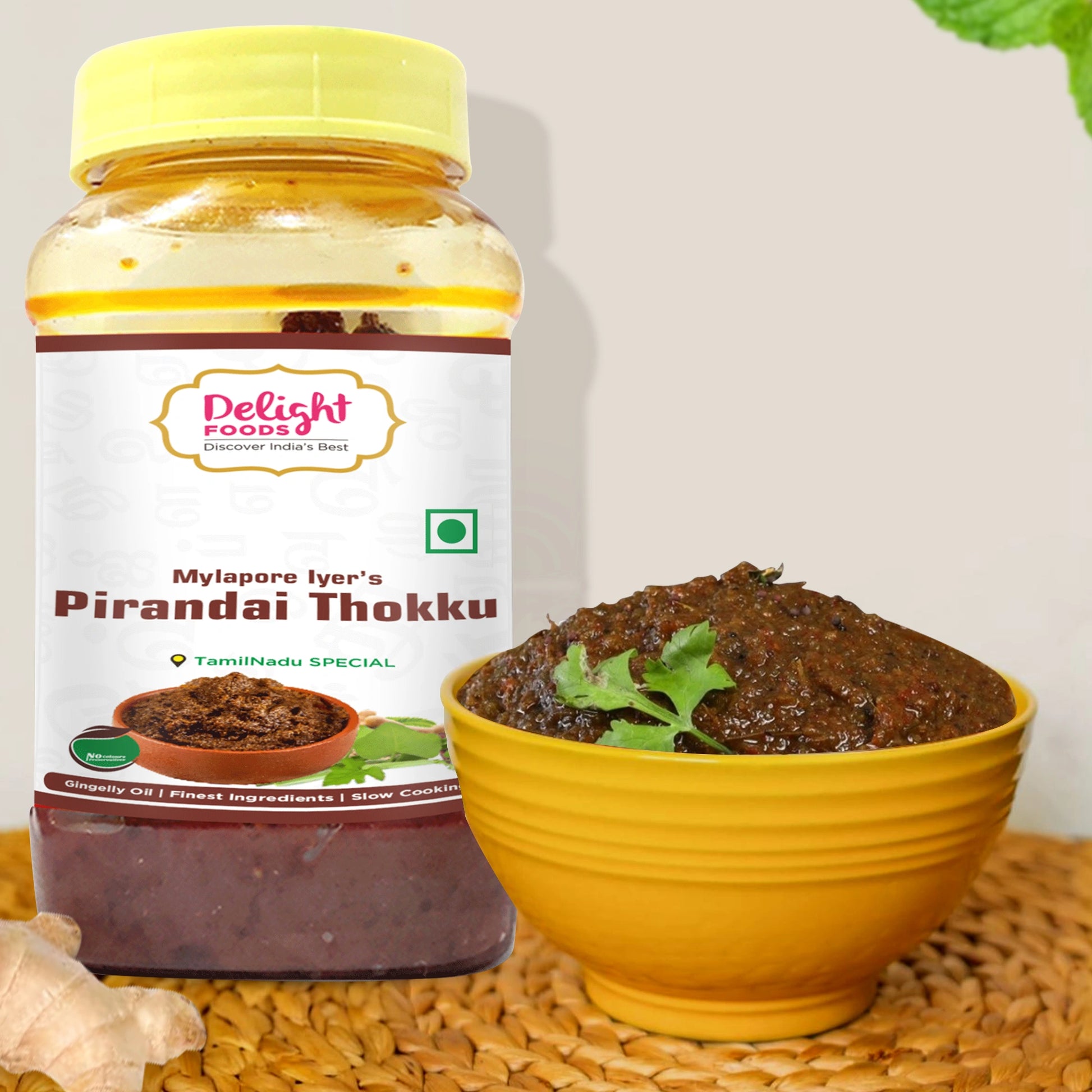 Jar of Delight Foods Mylapore Iyer's Pirandai Thokku with a bowl of the product on a textured surface.