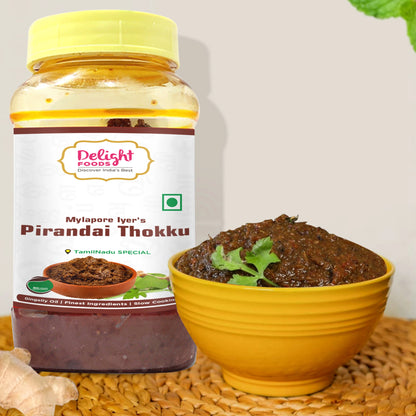 Jar of Delight Foods Mylapore Iyer's Pirandai Thokku with a bowl of the product on a textured surface.