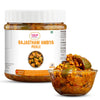 Jar of 'Rajasthani Ambiya Pickle' with a bowl of pickle on a white background